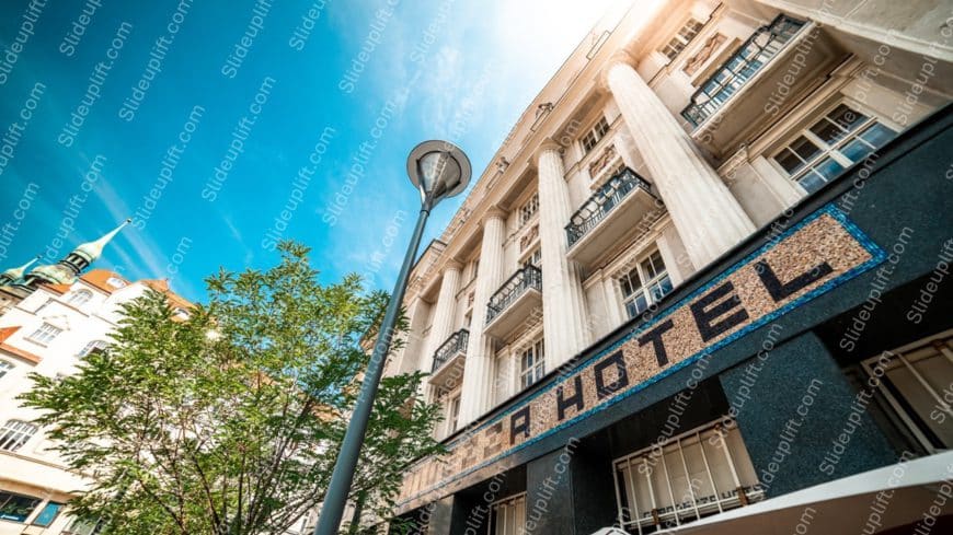 Blue sky white building green trees street lamp background image