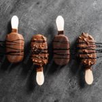 Brown Chocolate Popsicles Grey background image & Google Slides Theme