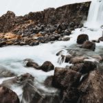 Brown Rocks Waterfall background image & Google Slides Theme