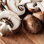 Brown White Mushrooms Wooden Background Image & Google Slides Theme