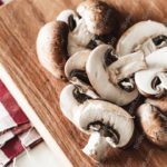 Brown White Mushrooms Wooden Board Red White Checked Napkin background image & Google Slides Theme