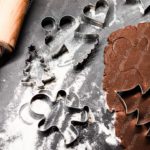 Brown rolling pin and cookie cutters flour dusted background image & Google Slides Theme