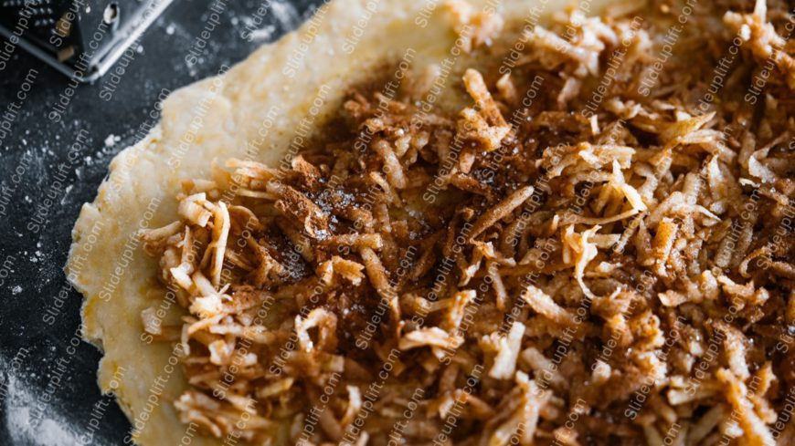 Golden brown fried onions on dough background image