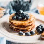 Golden pancakes blueberries white plate background image & Google Slides Theme