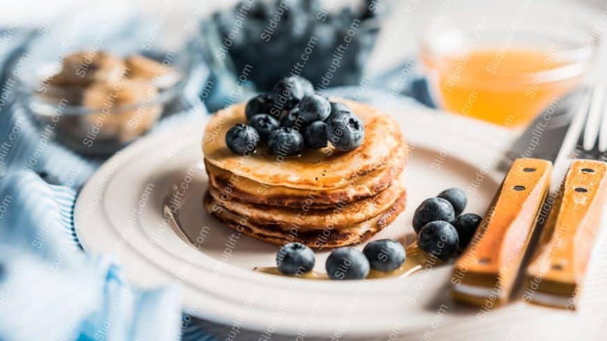 Golden pancakes blueberries white plate background image