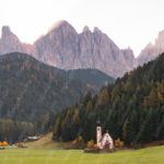 Green Meadow PineTrees GreyMountains PinkWhiteChurch background image & Google Slides Theme