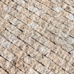 Grey Brown Cobbled Pavement background image & Google Slides Theme