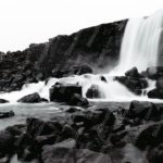 Monochrome Waterfall Rocks background image & Google Slides Theme