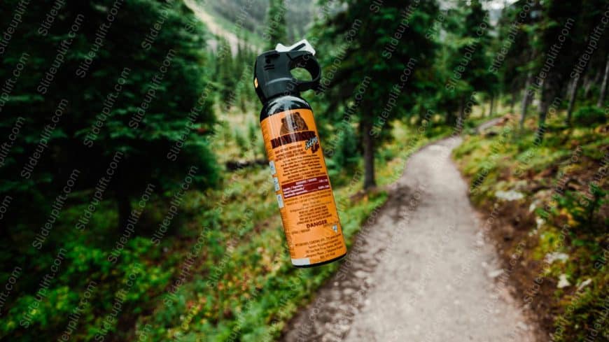 Orange Black Bear Spray Can Forest Path background image