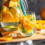 Orange Sliced Fruit Glass Beverage background image & Google Slides Theme