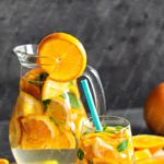 Orange and Green Beverage in Glassware background image & Google Slides Theme