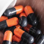 Orange and black capsules palm background image & Google Slides Theme