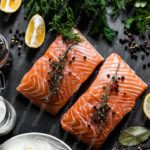 Orange salmon fillets dark grey background image & Google Slides Theme