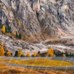 Orange yellow trees grey mountain road background image & Google Slides Theme