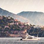 Peach White Yacht Mountainous Coastline background image & Google Slides Theme