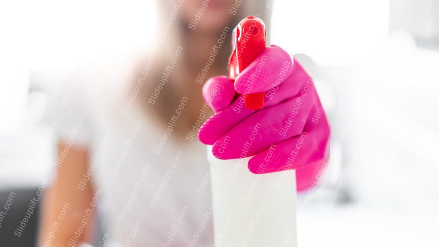 Pink Gloved Hand with Spray Bottle background image