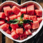 Pink cubed watermelon heart shaped bowl background image & Google Slides Theme