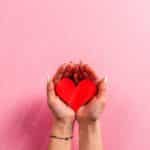 Red Heart Pink Hands background image & Google Slides Theme