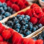 Red Raspberries Blue Blueberries Wooden Baskets background image & Google Slides Theme