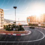 Sunset Toned Buildings Curved Road Flagpoles background image & Google Slides Theme