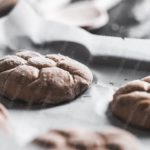 Warm brown cookies on parchment background image & Google Slides Theme