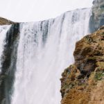 White Waterfall Brown Green Cliff background image & Google Slides Theme