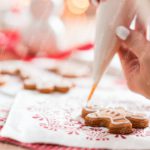 White icing brown cookies red white patterned fabric background image & Google Slides Theme