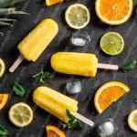 Yellow Popsicles Citrus Fruits Dark background image & Google Slides Theme