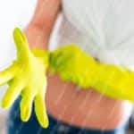 Yellow gloves person background image & Google Slides Theme