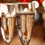 Amber Champagne Glasses Bokeh Background Image & Google Slides Theme