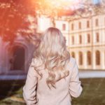 Beige Coat Blonde Hair Sunflare Education Building Background Image & Google Slides Theme