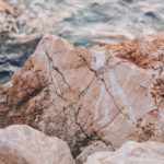 Beige And Brown Rocks Seascape Background Image & Google Slides Theme