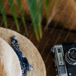 Beige Hat And Camera Brown Background Image & Google Slides Theme