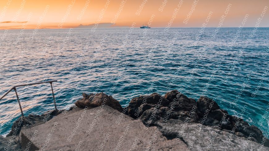 Blue Ocean Sunset Horizon Ship Rocks Background Image