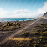 Emerald Grass Black Sand Road Coastal Mountain Background Image & Google Slides Theme