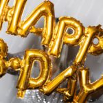 Gold Letter Balloons Background Image & Google Slides Theme