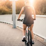 Golden Woman Cycling Warm Evening Background Image & Google Slides Theme