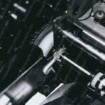 Monochrome Typewriter Mechanism Background Image & Google Slides Theme