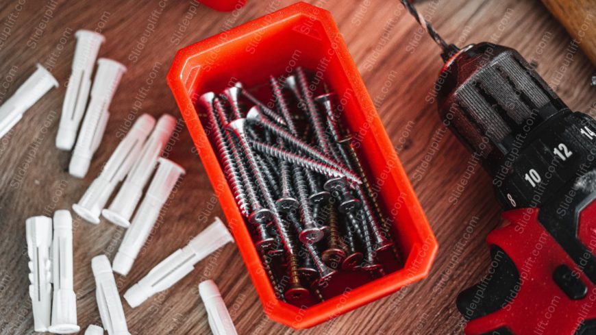 Red Black Screws And Drill Wooden Background Image