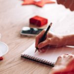 Red Polka Dot Sleeve Writing Hand White Cup Wooden Table Background Image & Google Slides Theme