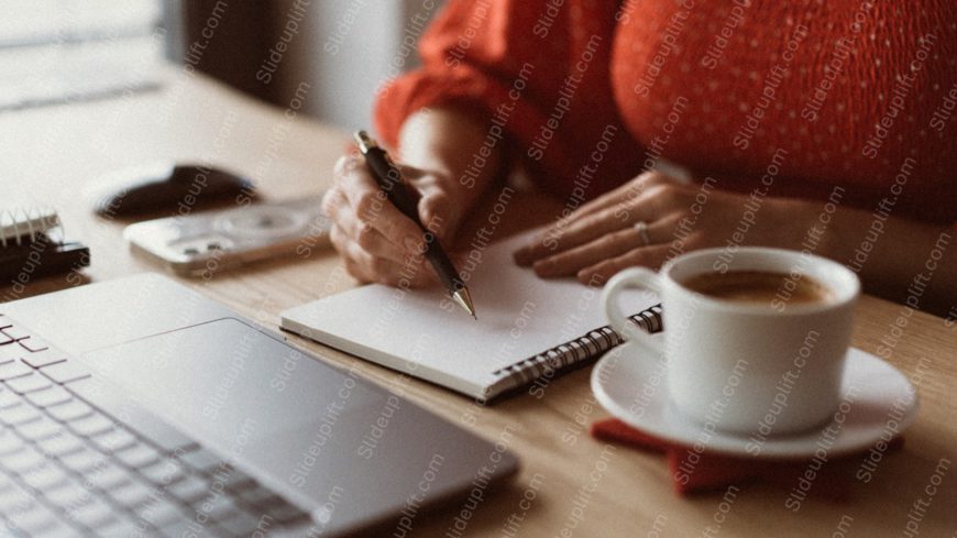 Red Sweatered Person Writing Notebook Laptop Coffee Cup Background Image