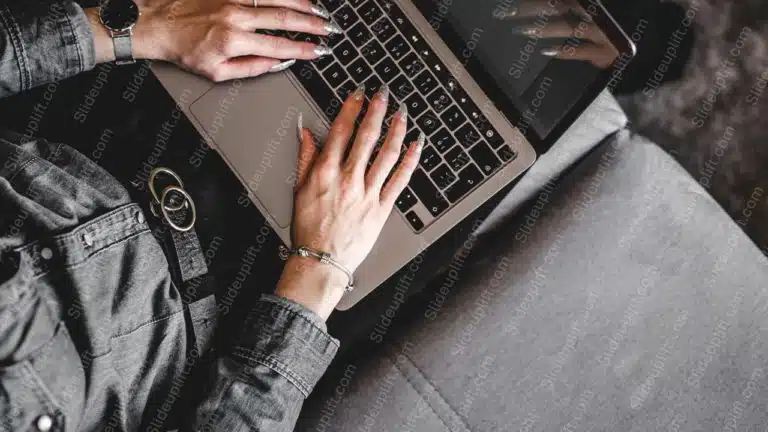 Silver Laptop On Gray Couch Background Image & Google Slides Theme