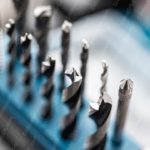 Silver Drill Bits Blue Background Image & Google Slides Theme