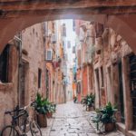 Terracotta Bicycle Alleyway Background Image & Google Slides Theme