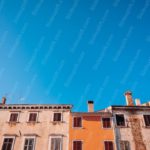 Terracotta Buildings Blue Sky Background Image & Google Slides Theme