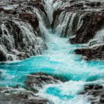 Turquoise Waterfall Background Image & Google Slides Theme