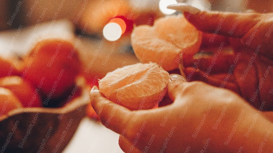 Warm Orange Peeled Fruit Hands Background Image