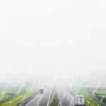 White Grey Misty Highway With Green Fields Background Image & Google Slides Theme