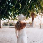 White Dress And Hat Woman Green Leaves Background Image & Google Slides Theme