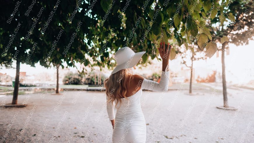 White Dress And Hat Woman Green Leaves Background Image